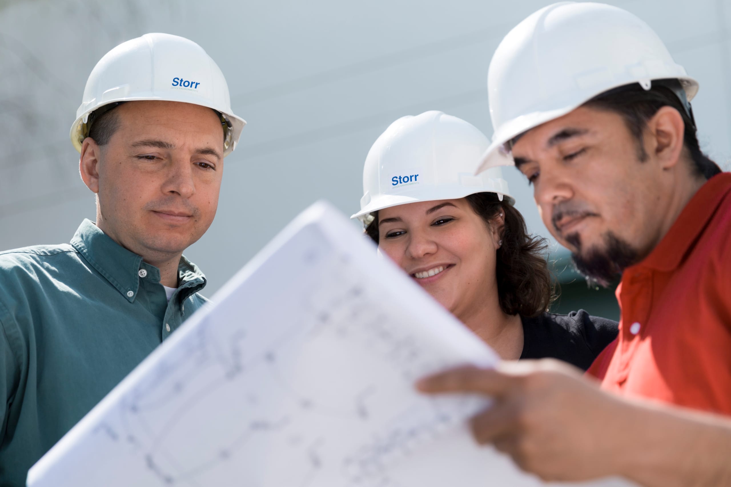 Services-Project-Management Project Managers on-site reviewing plans for successful install